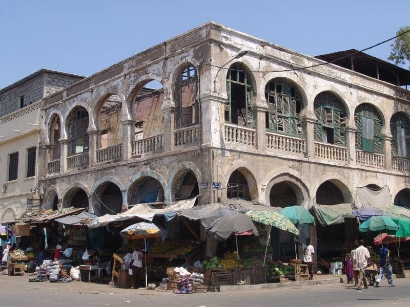 Arcaded corner building and market stalls in central Djibouti