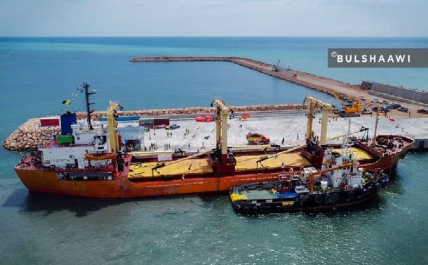 Cargo vessel moored at the completed quay