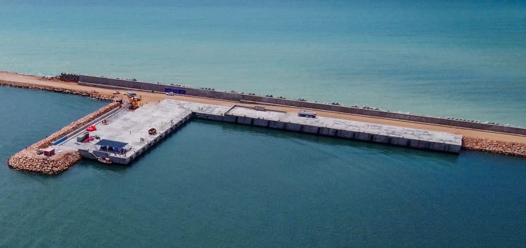 Concrete quay and rock breakwater of Garacad Seaport seen from the air