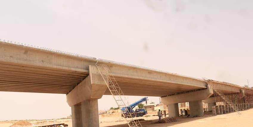 Prestressed concrete beams of a new bridge resting on cast-in-place piers